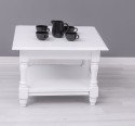 Coffee table with turned legs and a low shelf